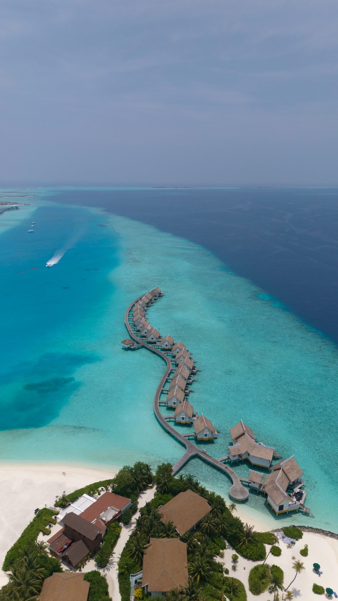 Aerial view of a turquoise island in the tropics